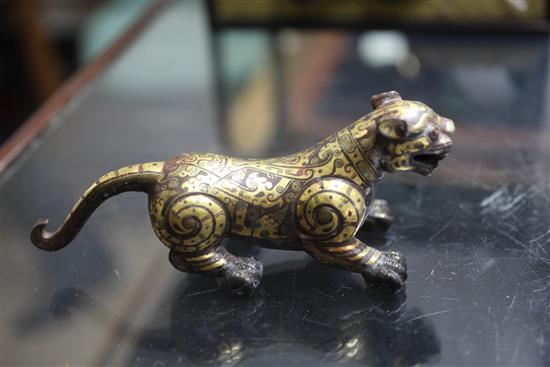 A Chinese parcel gilt bronze figure of a tiger, in Song dynasty style, length 18cm, together with a fitted hardwood box